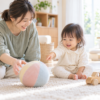ボールを指さす幼児と、一緒に遊ぶ母親（AI生成画像）